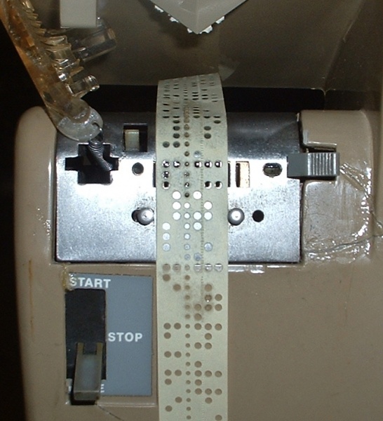 File:32 ASR tape reader Note tape guide studs.JPG